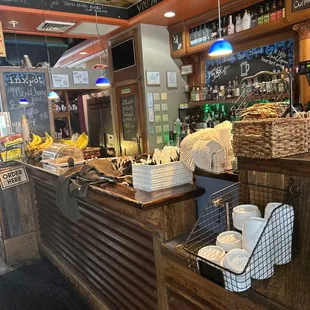 a view of a restaurant counter with baskets of food