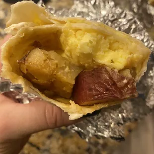 Burrito with only potatoes and egg. Was supposed to have bacon.