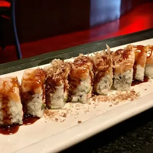 a sushi roll on a white plate
