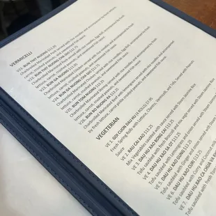 a close up of a menu on a table