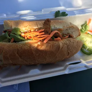 Half eaten chicken bahn mi