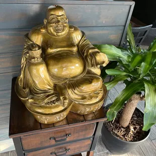 a statue of a laughing buddha