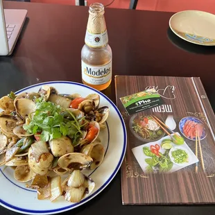 a plate of food and a bottle of beer