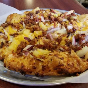 a pizza on a plate on a table