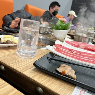 a group of people sitting around a table