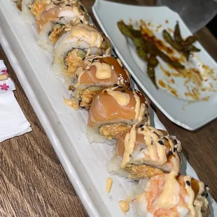 a long rectangular platter of sushi