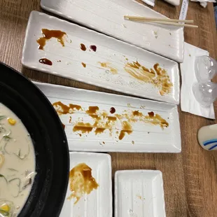 a number of plates of food on a table