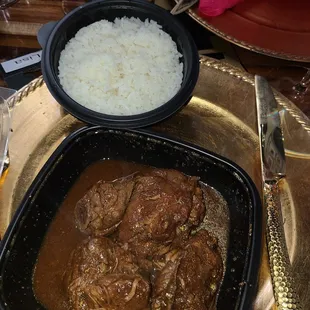 Brown stew chicken.  It took so long,  I asked for it to be boxed up.