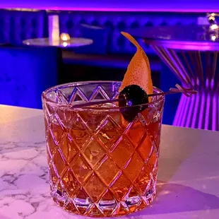 a cocktail in a glass on a table