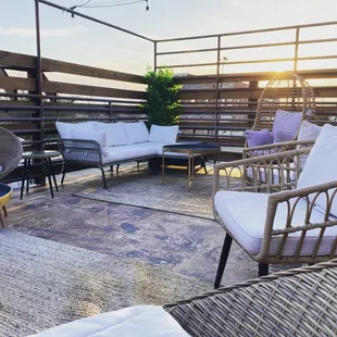 a patio with wicker furniture