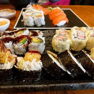 Lunch Sake Combo (far back) and 3 Maki Lunch Combo w/Crazy Maki (front), Crunch Maki (back right), and Eel Avo (back left)