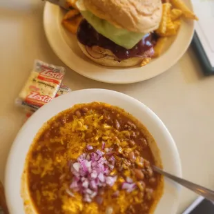 a plate of chili cheeseburger and a bowl of chili cheeseburger