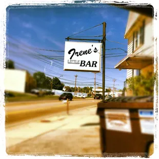 a sign for a little bar