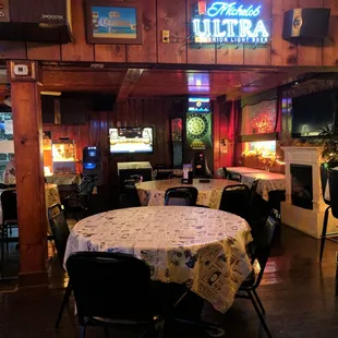 a dining area with tables and chairs