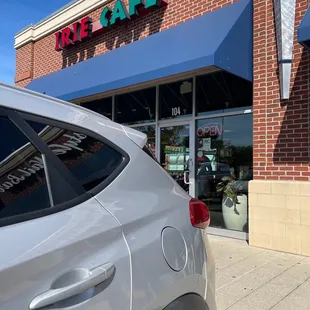 a car parked in front of the store
