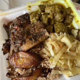 Jerk chicken, curried goat, sautéed cabbage, red beans and rice, and fried plantains.