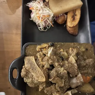 a plate of food and bread