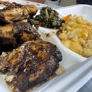 Jerk chicken with macaroni and cheese and greens