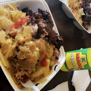 two take out containers of food