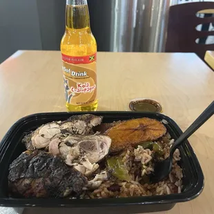Jerk chicken with rice and beans.
