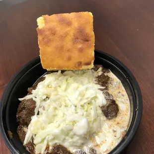 Jerk beef with mango slaw over rice and red beans
