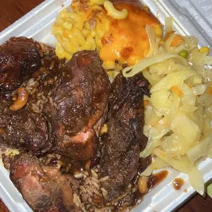 Jerk Chicken over Rice and Peas with Steamed Cabbage and Mac and Cheese