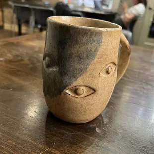 Decaf americano in a very cool mug.