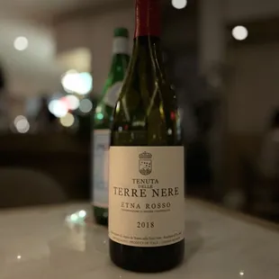 two bottles of wine on a table