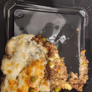 a slice of meat and cheese pie