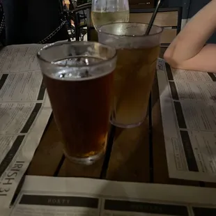 two glasses of beer on a table