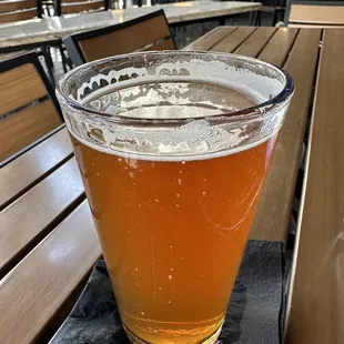 a glass of beer on a table