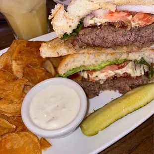 Black and blue burger with house chips