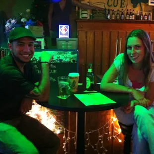 a man and a woman sitting at a table