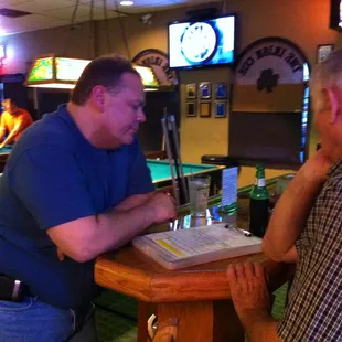 two men at a pool table
