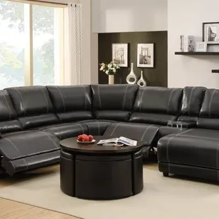Black bonded leather sectional with built in reliner and chaise.