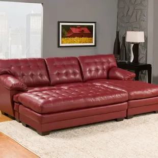 Super comfortable chaise sectional in bonded red leather with oversize ottoman.