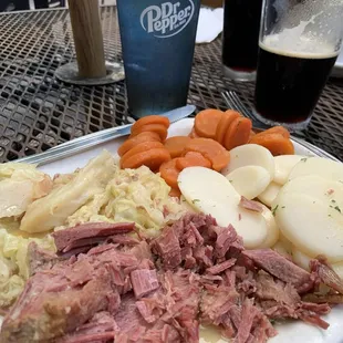 Corned Beef and Cabbage with carrots and sliced potatoes