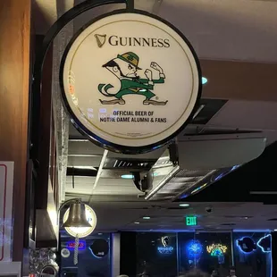 people sitting at tables in a pub