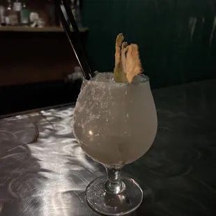 Cocktail with pineapple garnish.