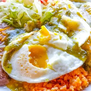 Green Enchiladas with extra eggs on top. Very good!