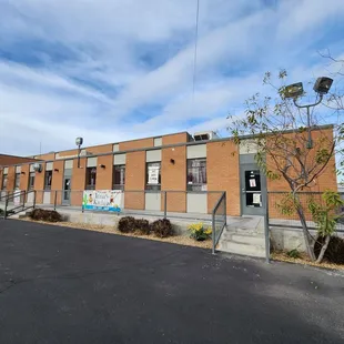 a brick building with graffiti on it