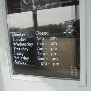 Hours of operation, front entry door - current closing time is 2 pm.