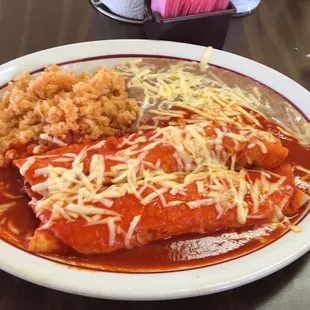 a plate of enchiladas and rice