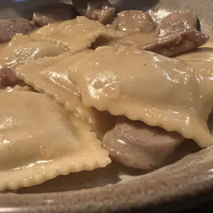 Pumpkin ravioli with chicken sauce in brown butter sauce