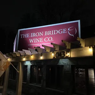 a sign for the iron bridge wine co
