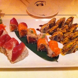 a platter of sushi and rolls