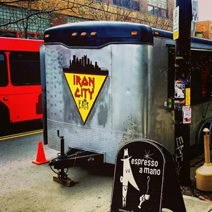 a food truck parked on the side of the road