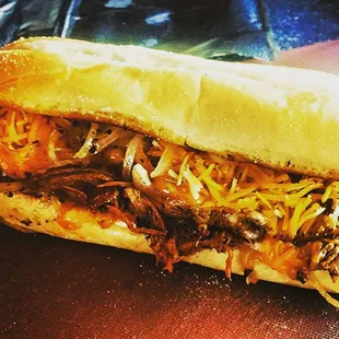 Braised Beef with cheddar jack cheese, grilled shallots and horseradish sauce