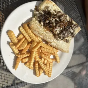 Philly cheesesteak and crispy French fries