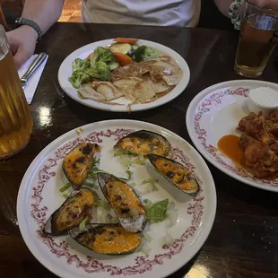 Pitcher of beer $14 piergoies Baked Mussels and Chicken Wings